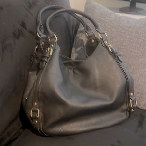 Black, “leather-like” handbag